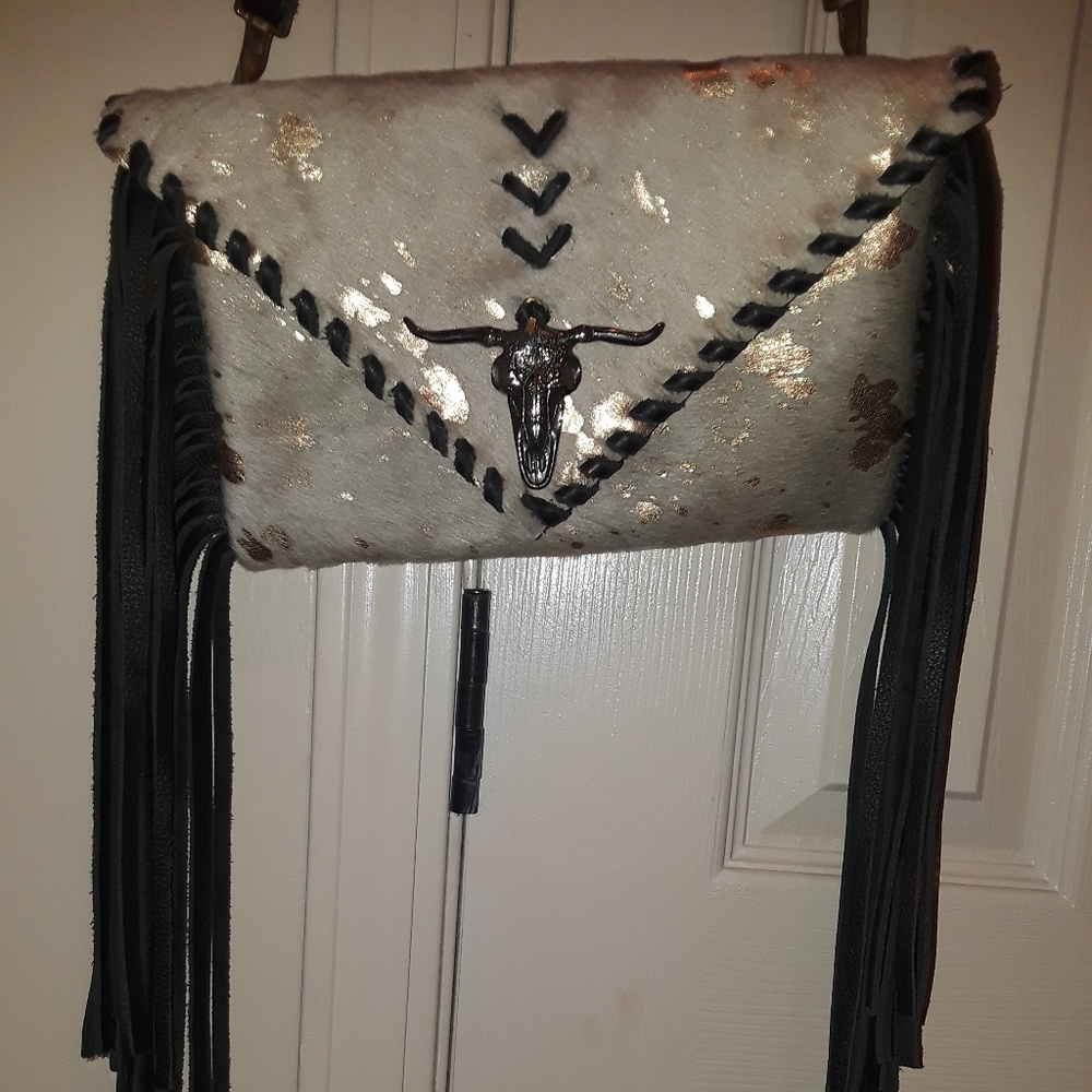 Cow hide fringe clutch purse